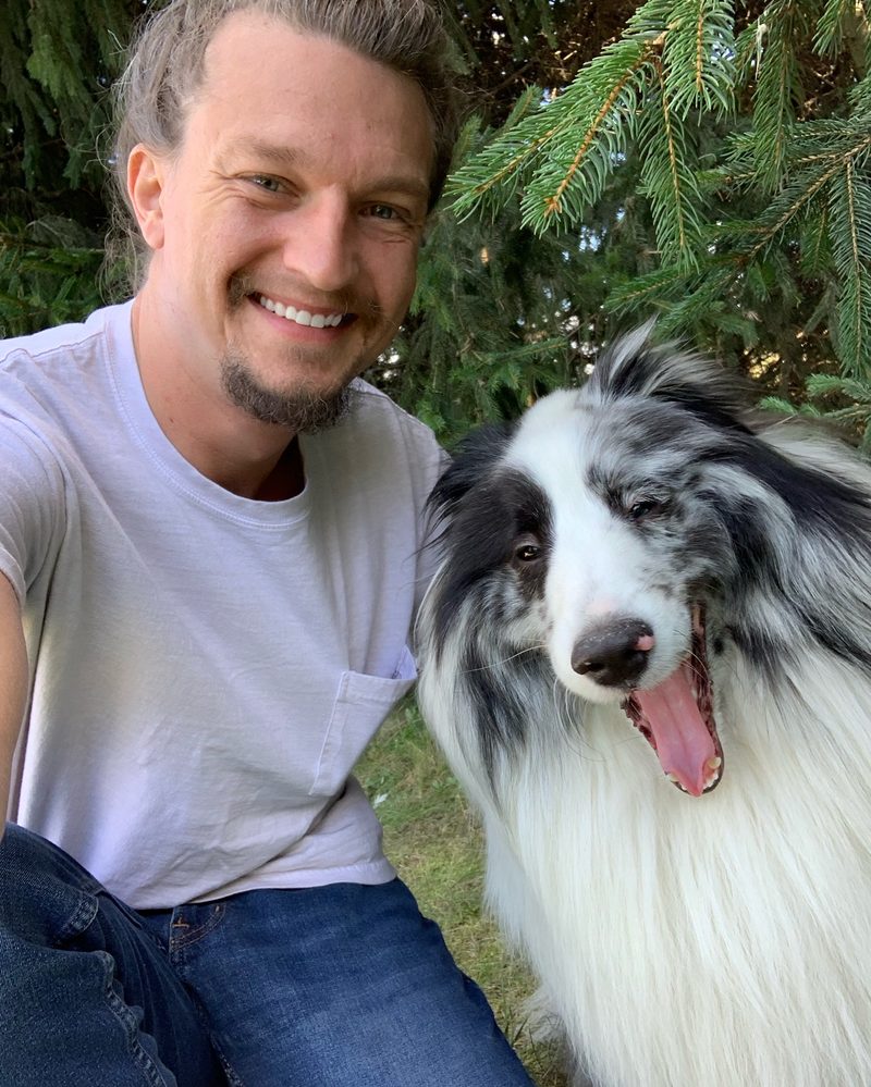 Ryan Eckerson, founder of Unrivaled SEM, outdoors with his dog